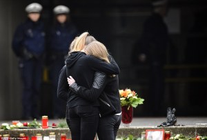 26F86C1500000578-3010610-Students_have_been_gathering_at_a_memorial_of_flowers_and_candle-a-34_1427318142913